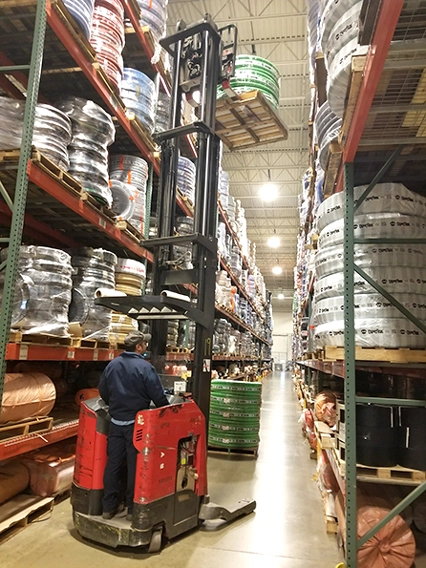 worker using forklift in our warehouse